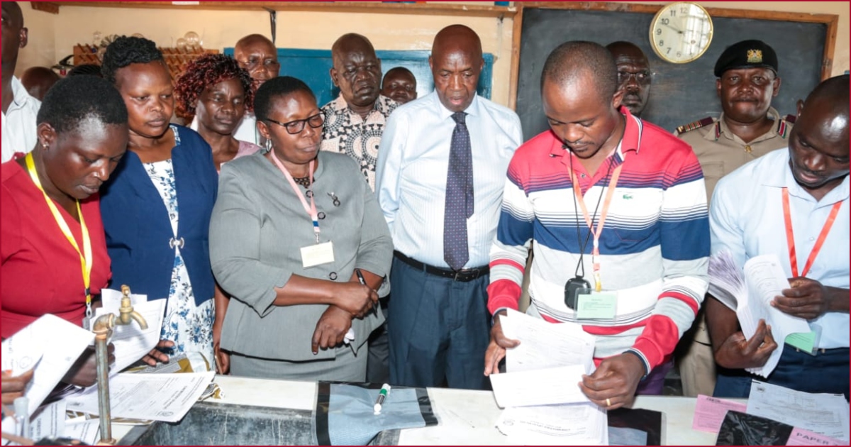Education CS Ezekiel Machogu (with black tie) witnessing the sealing of the KCSE examination papers.